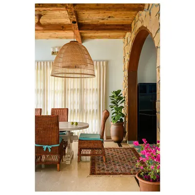 An archway does more than connect two rooms; it frames a view and adds a sense of grace and history. Here, we built a wide arch using Jaisalmer stone to create a grand, rustic transition from the dining area to the kitchen. It softens the lines of the space and adds a touch of medieval-inspired character.
