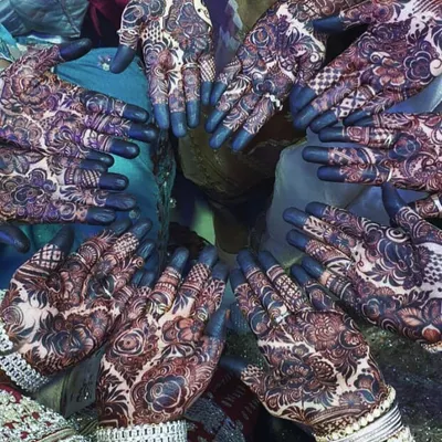 A beautiful shot of a group of hands adorned with my mehendi designs. This is perfect for a bridesmaid party or a family gathering before a wedding.