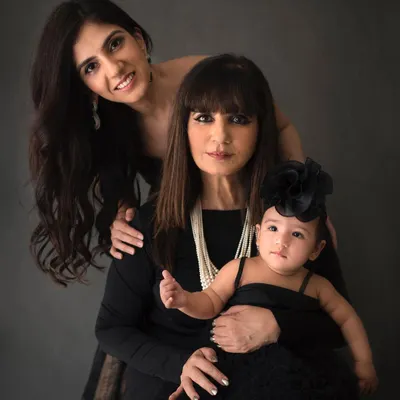 A stunning studio portrait of a grandmother, mother, and baby girl. Capturing three generations of beautiful women in one frame is an absolute honor. This is a true family heirloom.