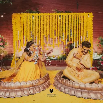 A fun and playful Haldi ceremony. I captured the moment right as the bride playfully puts haldi on the groom, showing the fun-loving nature of their relationship.