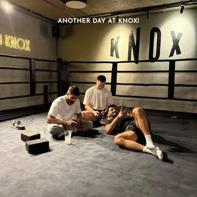 Another day at Knox. After a tough workout, members relax and hang out inside the boxing ring. This is what our community is all about: training hard and chilling together.