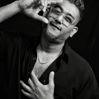 A black and white portrait from a recent photoshoot. This is part of my official press kit, showing a more confident and artistic side of my persona.