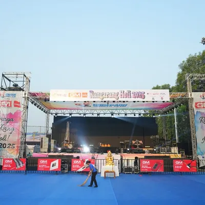 The calm before the storm at the Ranga Rang Holi 2025 event, featuring a performance by the iconic Sukhwinder Singh. This image shows the large outdoor stage and branded truss structure we constructed for the concert.