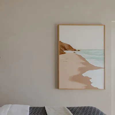 This serene, minimalist beachscape was installed in a Mumbai bedroom, creating a peaceful and calming atmosphere. The textured waves add a subtle 3D element to the painting.