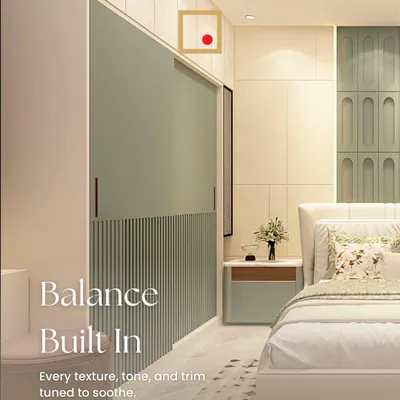 Balance is built into this serene bedroom. We used layered textures, a soothing color palette, and a fluted sliding wardrobe door to create a space that feels calm and composed.