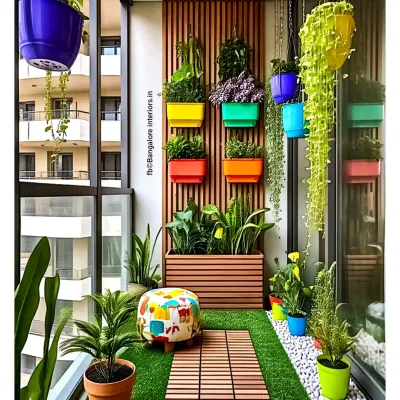 A vibrant and cheerful balcony garden. We used a wooden slat wall to mount colorful planters, creating a vertical garden that adds life and privacy. The artificial grass and playful pouf complete this fun, relaxing space.