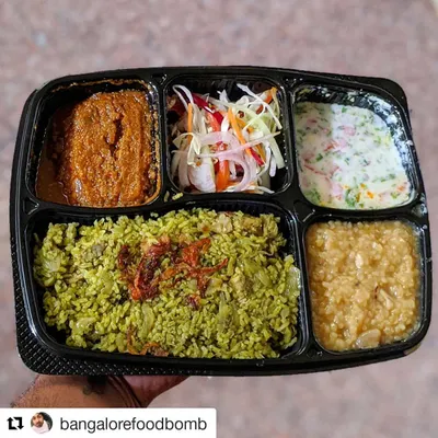 This is my complete Thuppangadi Chicken Biriyani meal. It includes the aromatic ghee rice with tender chicken, a spicy salan, cooling raita, a fresh salad, and a portion of sweet dal payasa to finish your meal perfectly.