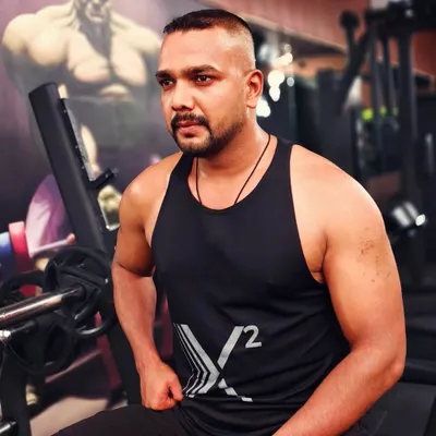 A moment of focus at the gym. My own fitness journey is ongoing, and it fuels my passion for coaching.