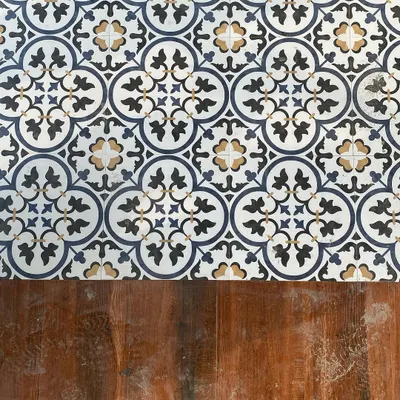 We love mixing materials to create visual interest. Here, you can see the beautiful contrast between the intricate, Moroccan-style patterned tiles and the warm, rustic texture of the hardwood decking we used in our Pioneer Araya project.