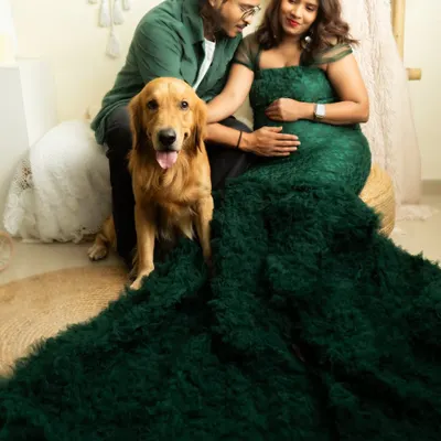 A dramatic maternity portrait with an expecting couple and their golden retriever. I love including pets in photoshoots, and this session shows how we can create a beautiful family portrait with everyone involved.