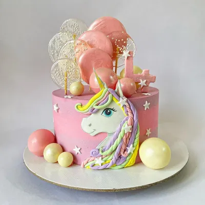 Be a unicorn in a field of horses! This magical unicorn cake features a hand-sculpted bas-relief unicorn with a pastel rainbow mane, surrounded by isomalt lollipops and chocolate spheres.