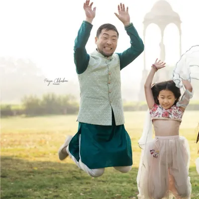 Pure, jumping-for-joy happiness! An outdoor family shoot in a Delhi park is the perfect place to let loose and capture energetic, fun-filled moments like this one.