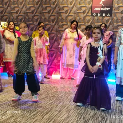 A close-up of our young performers during a workshop. Dressed in colorful traditional outfits, these kids are ready to showcase their new dance skills with confidence and big smiles.