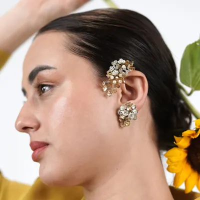 Why wear boring earrings when you can have a classic earcuff? This model shows how our bestselling crystal and pearl earcuff adds an instant touch of glamour and edge to her look.