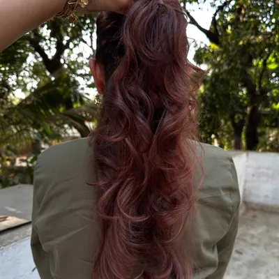 A 'Rose Gold' dream come true. We transformed her faded highlights into this stunning metallic pink shade. It’s a trendy yet sophisticated way to play with color.