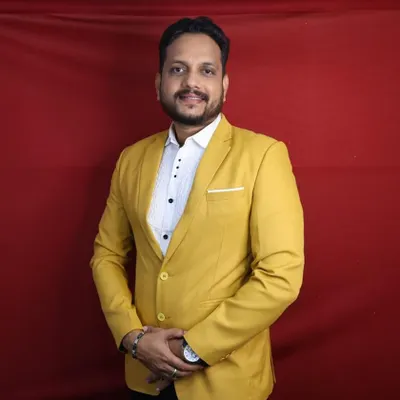 Make a bold statement at your next event with this vibrant yellow blazer, available for rent. It's a great choice for haldi functions or daytime parties, photographed here against our solid red studio backdrop.