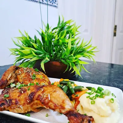 My Rosemary and Garlic Roast Chicken is a dish to remember, with a tantalizing aroma and incredible flavor. I serve the tender chicken legs with creamy mash and buttered vegetables for a complete gourmet meal.