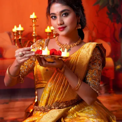 Let's celebrate Deepavali by spreading joy and light. A festive look for the beautiful Manvitha, captured in the warm glow of diyas.