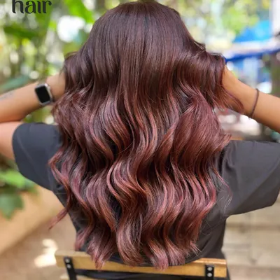 Blue skies and cherry cola floats. This look is right on trend, with deep red and violet tones creating the perfect cherry cola colour, styled in beautiful, soft waves.