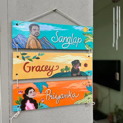 This three-tier nameplate was a beautiful surprise gift we created. It features portraits of Priyanka, her husband Sanglap, and their fur baby Gracey, each on their own colorful, themed plank.