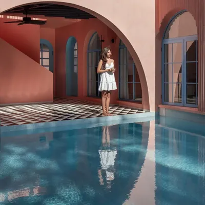 The central courtyard and pool at Baia Villas is the heart of the project. I designed this U-shaped layout to seamlessly connect the living spaces to this focal point, creating an indoor-outdoor experience that is quintessentially Goan.