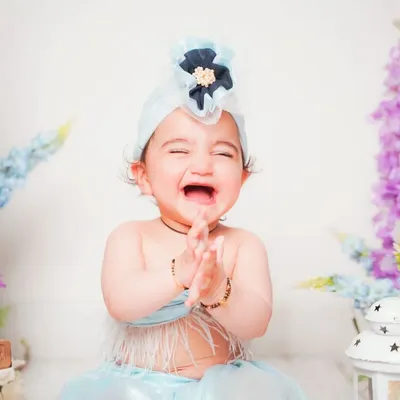 That pure, joyful laugh is everything! My studio is designed to be a fun space where babies feel comfortable enough to show off their true personalities.