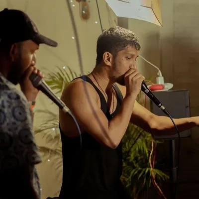 Going back and forth with another beatboxer during a live set. These vocal percussion duels are all about listening and reacting, which is a key skill we practice in my workshops.