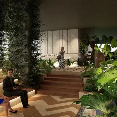 The clubhouse entrance for Marian Park in Mangaluru is designed as a journey through nature. Tiered seating, rich wooden steps, and abundant tropical plants guide visitors, creating a sophisticated and serene arrival experience.