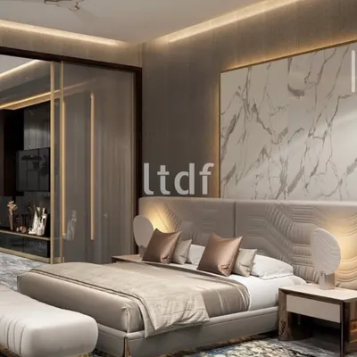 We believe a minimal palette reinforces architectural legibility. This bedroom is a controlled composition where volume and proportion drive the design. The marble panel and sculpted headboard act as the visual anchor, while secondary elements remain deliberately recessive.
