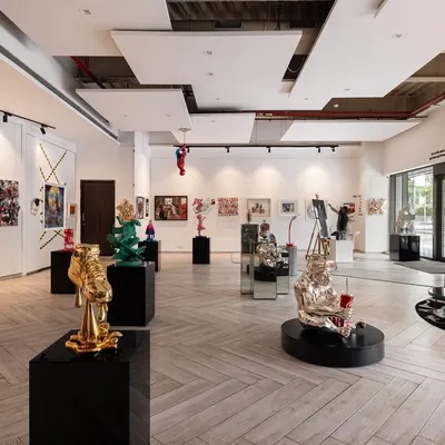 A wide view of our gallery, designed with an open floor plan to allow each artwork room to breathe. The arrangement of sculptures and wall art creates a journey for the viewer, with conversation starters at every turn.
