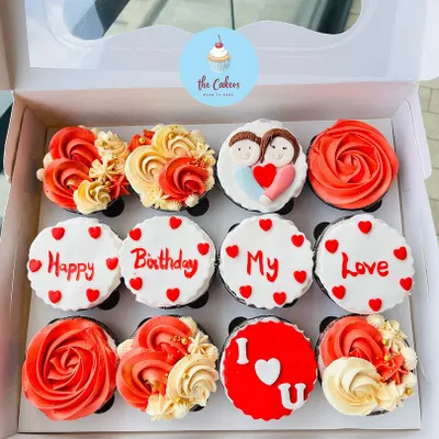 This box of twelve custom cupcakes is a perfect romantic gift for a birthday or anniversary. The designs include intricate frosting roses and personalized messages like "Happy Birthday My Love" and "I ❤️ U".