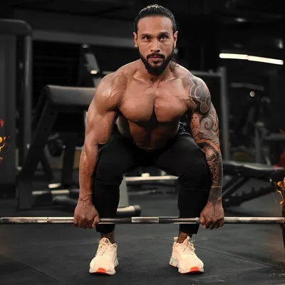 The deadlift is a fundamental exercise for building raw power and a strong posterior chain. I ensure your form is perfect to maximize gains and prevent injury.
