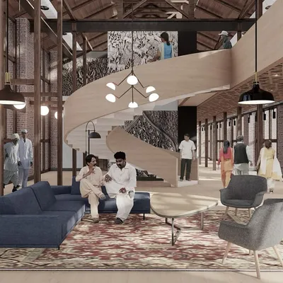 A central feature of our adaptive reuse plan is this lounge area, complete with a contemporary spiral staircase. It demonstrates how modern architectural interventions can create functional, inviting spaces within a historic industrial setting.