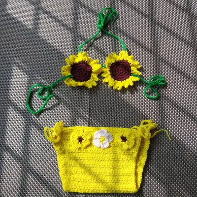 A custom sunflower bikini set I made for a client. This version features a bright yellow bottom with small flower details and a top made of two cheerful sunflowers. It's perfect for a summer-themed celebration.