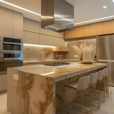 This is the definition of a luxury kitchen, centered around a stunning marble waterfall island with seating for four. The design features handleless cabinetry, integrated high-end appliances, and a powerful statement chimney hood for a professional-grade cooking experience.