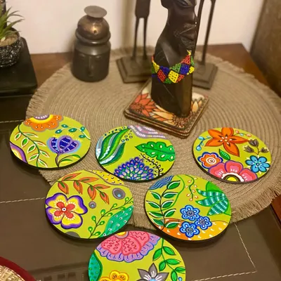 This set of six funky and fun coasters was a custom order for a wonderful client. Each coaster has a unique, vibrant floral design, making them functional pieces of art for your table.
