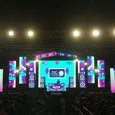 On stage at Parul University, facing a sea of people. The scale of this event shows my experience in handling massive concert crowds and large productions.