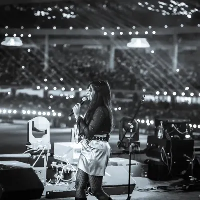 A black and white moment from the RCB Unbox stage. In front of thousands, I felt the collective energy of the crowd, a truly unforgettable experience for any live performing artist.