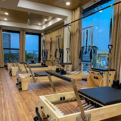 Our studio is filled with natural light and equipped with multiple Pilates reformers, creating a serene atmosphere for your workout.