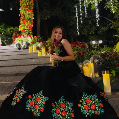 A quiet moment before the storm of the party. This beautiful black gown with floral embroidery was perfect for a romantic and elegant evening reception.