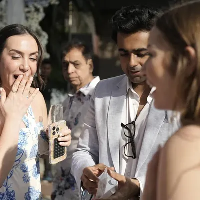 The moment of revelation. A guest at a beautiful wedding in Indore reacts with pure shock as the magic unfolds right before her eyes.