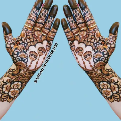 This symmetrical, full-hand design is a perfect example of heavy guest mehandi. The pattern is dense with fine lines and traditional motifs, ensuring a dark, rich stain.