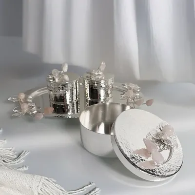 Grace in every detail. My Rose Quartz Collection, featuring this lidded box and salt and pepper shakers, blends handcrafted silver with delicate crystal accents for a statement in serenity and strength.