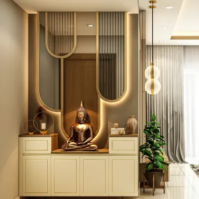 A modern and elegant pooja unit designed for a niche space. The design features a serene Buddha statue, backlit panels with intricate mirror work, and integrated storage cabinets below.