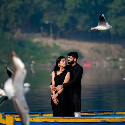 A quiet moment on the Yamuna river. Pre-wedding photography is about finding a space where you can just be yourselves, and my job is to capture that connection.