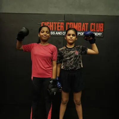 Two of our young female warriors, geared up and ready to train. We instill a mindset of strength and fierceness in all our students, teaching them they are unstoppable.