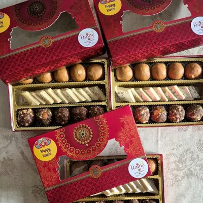 My assorted sweet boxes with "Happy Rakhi" stickers, ready for the festival. Gifting fresh, homemade sweets is a wonderful way to show you care.