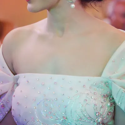 This is a detailed view of the hand-beaded bodice on the light pink engagement gown. I used a mix of pearls and sequins to create a subtle shimmer that catches the light beautifully.