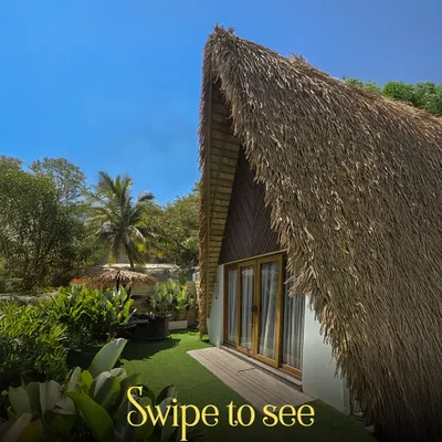 Your room at Holiday Village awaits. This view of our A-Frame cottage shows the private entrance and personal green space that makes your stay feel exclusive and serene.