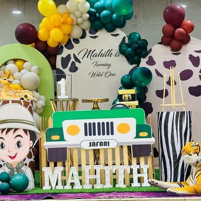 Here is another look at the 'Wild One' safari theme we created for Mahith. We used animal print backdrops, a safari jeep prop for the cake, and lots of animal cutouts to make the kids feel like they were on an adventure.